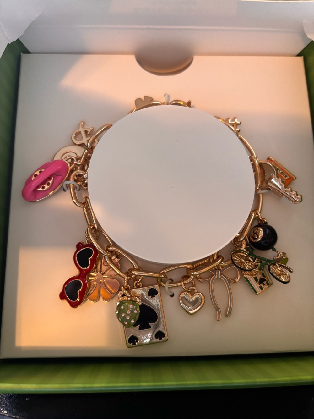 kate spade Gold Charm Bracelet with Pink, Black, Green and Red Enamel Accents - Picture 2 of 2
